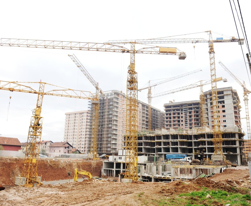 Site buildings under construction and cranes