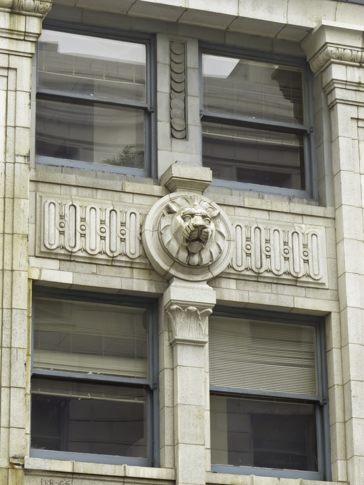 Detail of neoclassical design on skyscraper originally a bank designed by Daniel Hudson Burnham in 1911 in the financial district of downtown Chicago
