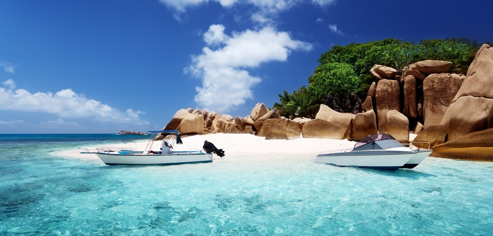 speed boat on the beach of Coco Island Seychelles